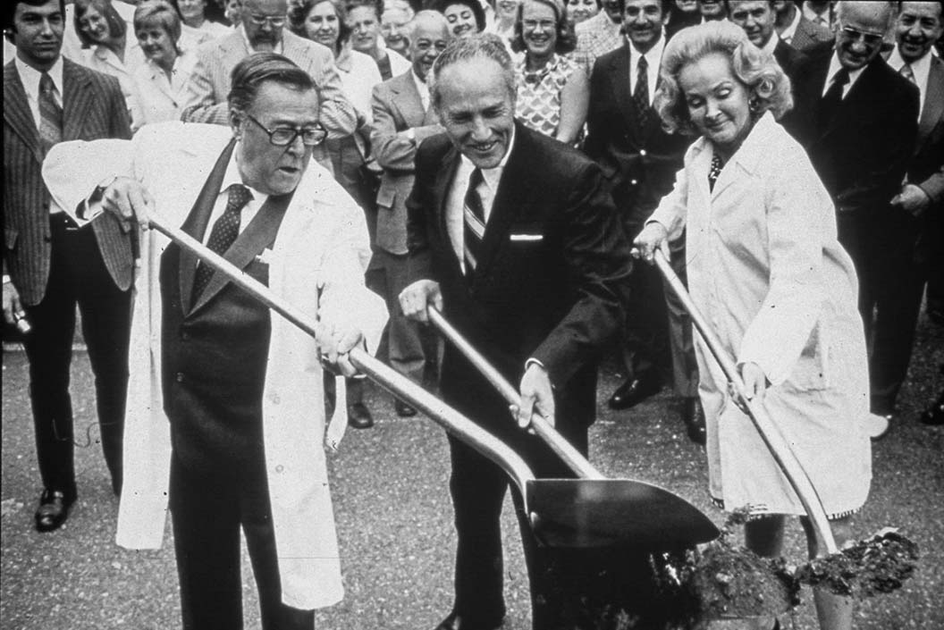 Warren Magnuson, his wife Jermaine, and Dr. William Hutchinson with the shovels for ground-breaking in 1973 for Fred Hutchinson Cancer Research Center, First Hill building.