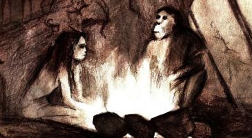 Drawing of ancient humans in a cave sitting by a fire