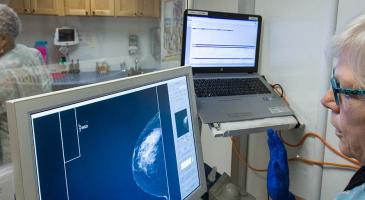 Medical staff review mammogram on computer screen. Photo by Robert Hood / Fred Hutch News Service