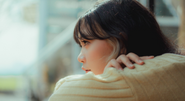 Photo of woman looking out window