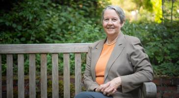 Photo of Lianne Sheppard sitting on a bench