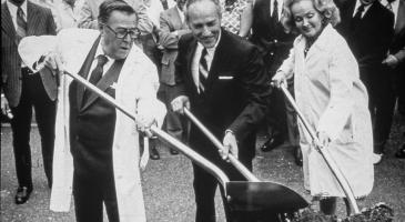 Warren Magnuson, his wife Jermaine, and Dr. William Hutchinson with the shovels for ground-breaking in 1973 for Fred Hutchinson Cancer Research Center, First Hill building.