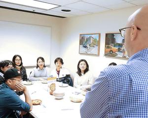 Photo of Biostatistics MS Capstone student meeting with Adam Szpiro