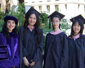 Group photo of four UW Biostatistics student graduates, 2024