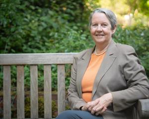 Photo of Lianne Sheppard sitting on a bench