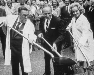 Warren Magnuson, his wife Jermaine, and Dr. William Hutchinson with the shovels for ground-breaking in 1973 for Fred Hutchinson Cancer Research Center, First Hill building.