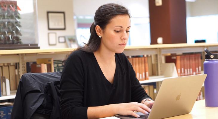 UW Biostatistics MS Thesis student working in a library