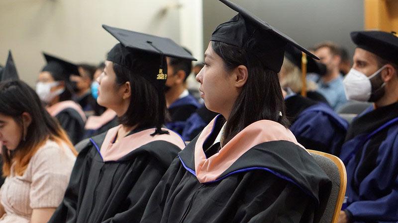 Two student graduates in MS Capstone Program attending 2022 graduation event