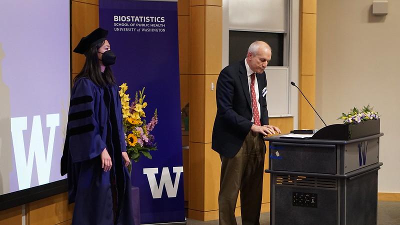 Angela Zhang receives award from Thomas R. Fleming